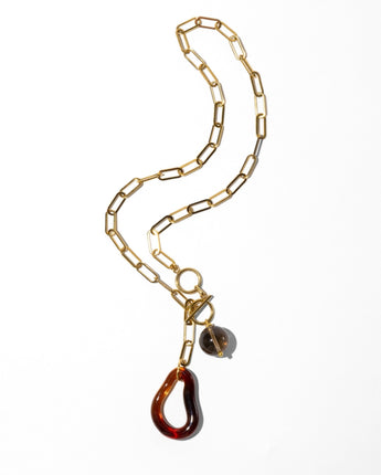 Katerina Psoma Plume necklace — Murano glass wave pendant and smoky quartz bead on a gold paperclip chain