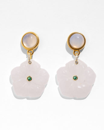 Katerina Psoma Gemma earrings — hand-carved pink quartz flower with a green crystal center on a gold cabochon stud