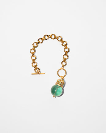 Katerina Psoma Cupola bracelet ā fluorite bead set on a gold plated chain with turquoise and crystal gold-plated dome