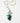 A gold chain necklace featuring a grapevine pendant with green and lavender beads, green enamel leaves, and a faceted iridescent bead at the top, displayed on a clean white background.