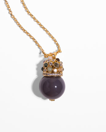 Detail of Katerina Psoma Cupola pendant chain necklace with a polished grey agate and gold plated metal dome adorned with stones