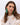 A model wearing Katerina Posma Flamenco earrings — green sequin fringe on a lace-pattern clip disc
