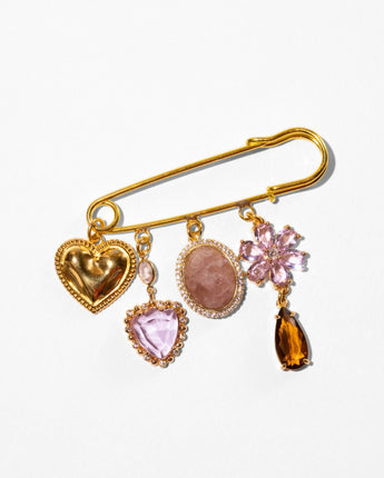 Katerina Psoma Amulet brooch — gold heart, crystal flower and stone charms on a gold safety pin