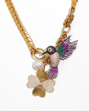 detail of Katerina Psoma Colibri necklace — gold chain with pearl, pavé crystal clover and detachable hummingbird brooch charm