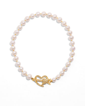 Katerina Psoma Greta necklace — freshwater pearls with a pavé crystal heart and arrow magnetic clasp