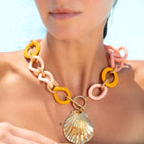Katerina Psoma Necklace with orange and pink links and a gold shell pendant 