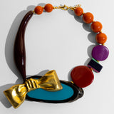 Katerina Psoma  Colorful short necklace with beads and a gold bow 