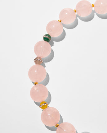 detail of Katerina Psoma Cashmere necklace — rose quartz beads with scattered vintage agate accents and a pavé gold clasp