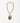  Katerina Psoma Plume necklace made of a teardrop handmade Murano glass pendant in brown, amber and red colors set on a gold plated thick metal chain with a toggle clasp. 
