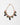 A gold-tone chain necklace with pink and green floral embellishments, featuring faceted green beads, pink enamel leaves, and teardrop-shaped purple and green stones, displayed on a clean white background.
