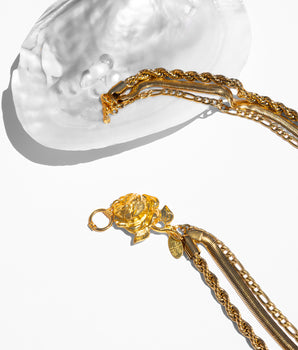 katerina psoma gold plated 3 row necklace with a metal rose clasp