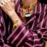 Katerina Psoma Short necklace with gold chain and a central green and white marbled bead 