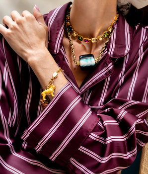 Katerina Psoma Short necklace with gold chain and a central green and white marbled bead 