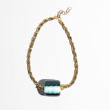 Katerina Psoma Short necklace with gold chain and a central green and white marbled bead 