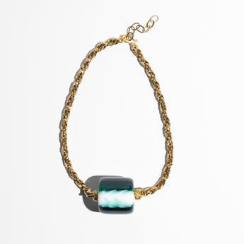 Katerina Psoma Short necklace with gold chain and a central green and white marbled bead 