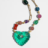 Necklace with colorful beads and a green heart-shaped pendant 