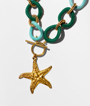 Katerina Psoma Necklace with green and turquoise rope links and a gold starfish charm 