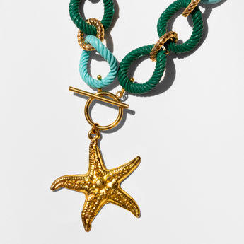 Katerina Psoma Necklace with green and turquoise rope links and a gold starfish charm 