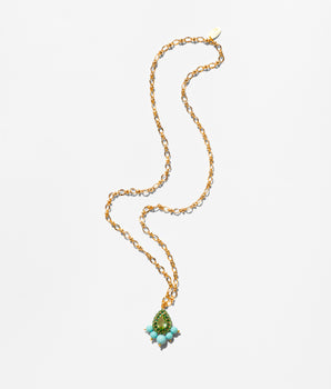 Katerina Psoma Gold necklace with a green teardrop pendant on a white background