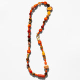 Katerina Psoma Necklace with orange and brown beads on a white background
