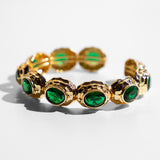 Katerina Psoma gold plated metal bracelet with green crystals