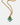 Gold necklace with a green teardrop pendant and turquoise beads on a white background