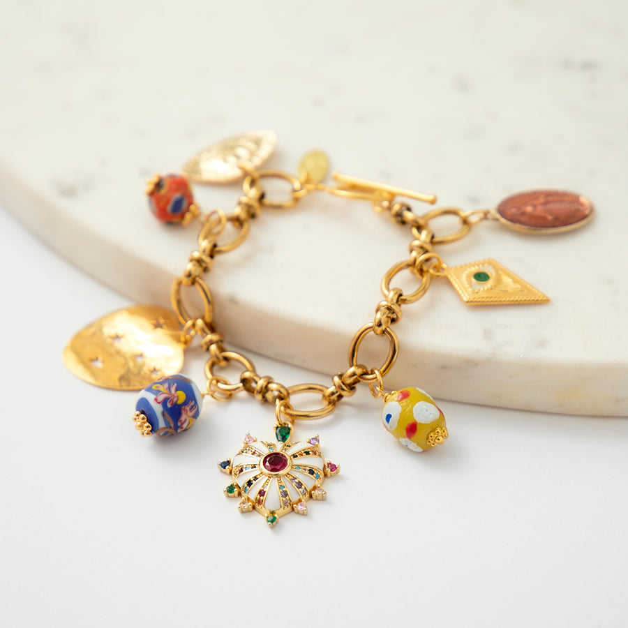katerina psoma charm bracelet with trade beads and enamel boho style